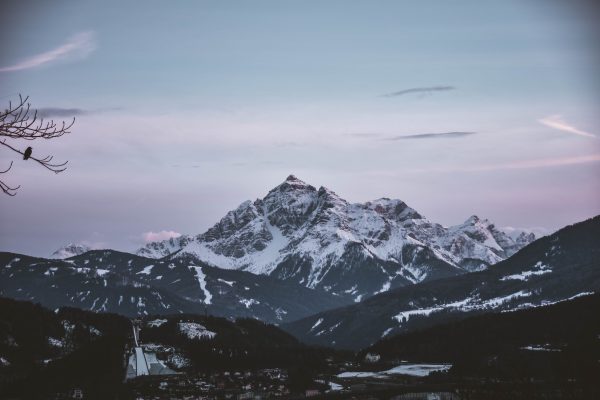 Majestic snow-capped mountains in Innsbruck, Austria, captured during winter twilight. Nature 4K