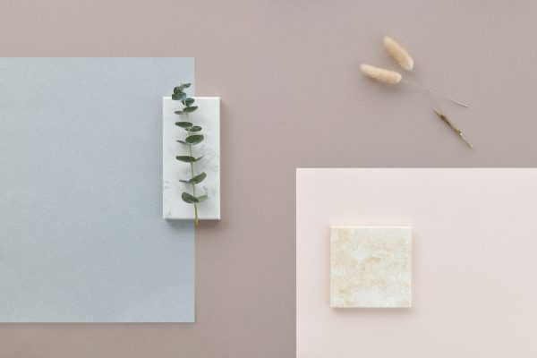 Modern flat lay design featuring marble, eucalyptus, and dried flowers on a pastel background. Minimaliste 4K
