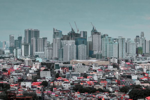 Panoramic view of the bustling cityscape of Pasay City with a skyline of skyscrapers and urban residential areas. Architecture 4K
