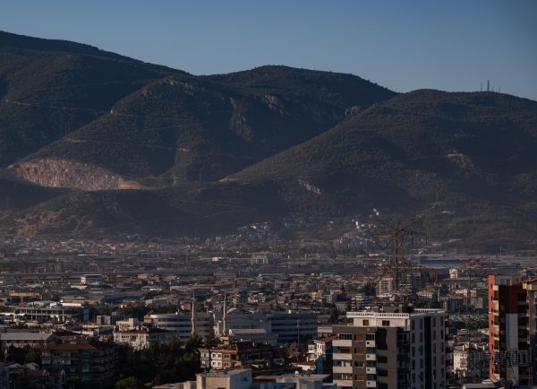 Panoramic view of İzmir city against a backdrop of lush mountains in daylight. Nature 4K