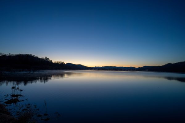 Peaceful sunset view over a serene lake in Tell, Wisconsin. Tranquility and natural beauty. Nature 4K