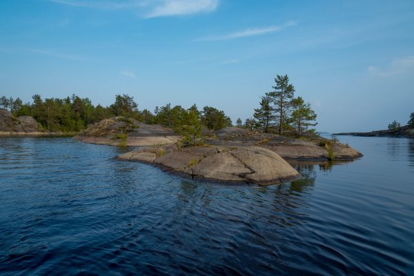 Peaceful view of rocky islands with trees in Lake Ladoga, Karelia, Russia. Nature 4K