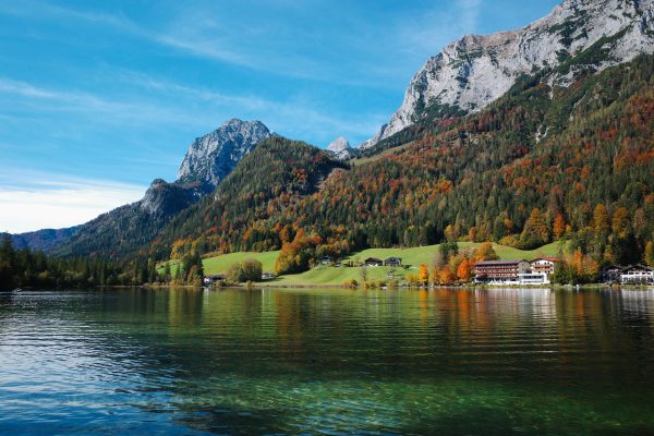 Picturesque autumn landscape of Hintersee Lake with vibrant foliage and majestic mountains in Germany. Nature 4K