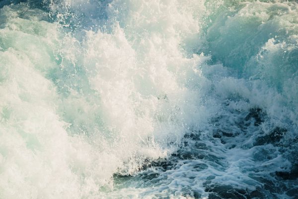 Powerful ocean waves crashing onto the shore, capturing the energy and beauty of nature. Nature 4K