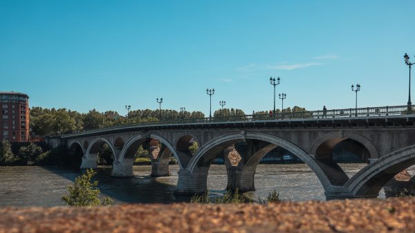 Scenic view of Pont Saint-Pierre bridge crossing the Garonne River in Toulouse, France. Architecture 4K