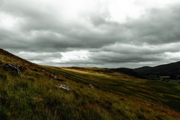 Scenic view of rolling hills and dramatic skies in the Scottish Highlands, UK. Nature 4K