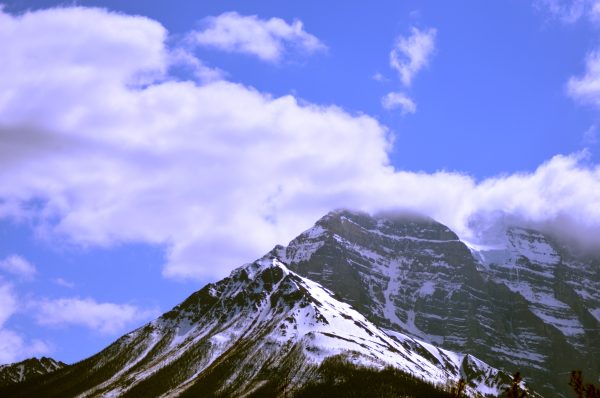 Scenic winter view of snowy mountains under a blue sky in Golden, British Columbia. Nature 4K