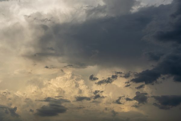 Striking cloudscape featuring dramatic dark storm clouds against a moody sky. Dark 4K