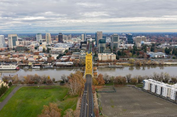 Stunning aerial shot of Sacramento skyline and the iconic Tower Bridge on a cloudy day. Architecture 4K