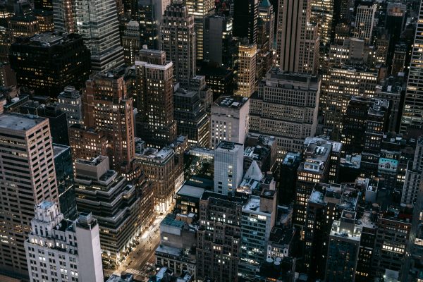 Stunning aerial view of New York City's illuminated skyline captured at night. Architecture 4K