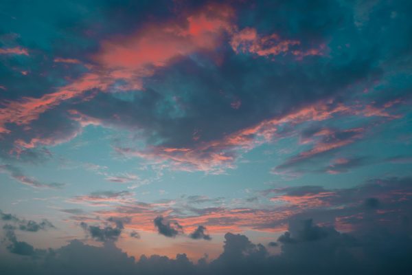 Stunning image capturing the vivid colors of a twilight sky with pink and blue clouds. Nature 4K