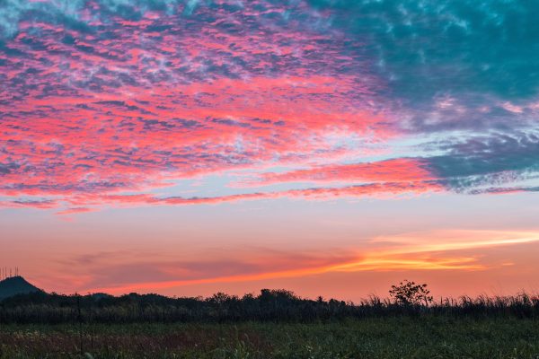 Stunning pastel sky at sunset over a serene natural landscape, evoking tranquility and wonder. Nature 4K