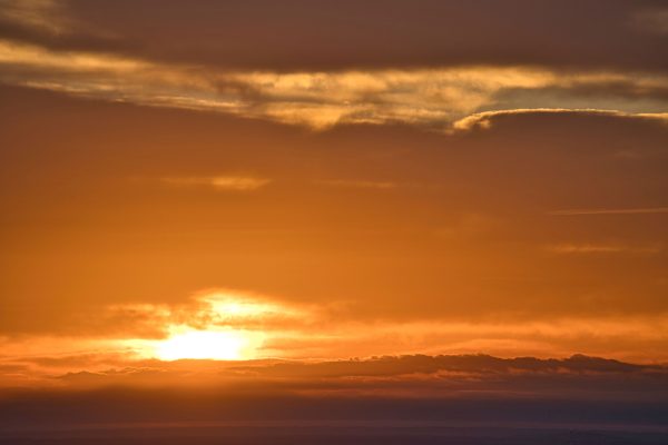Stunning sunrise with golden hues and clouds over Stone Mountain, Georgia. Nature 4K