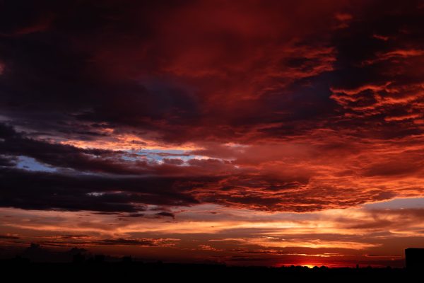 Stunning sunset over Belo Horizonte with vibrant red, orange, and purple clouds. Nature 4K