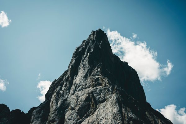 Stunning view of a rocky mountain peak under a clear blue sky in Banff, Alberta. Nature 4K