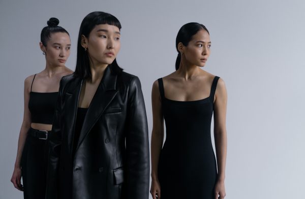 Three stylish Asian women posing in black outfits during a studio fashion shoot. Charme 4K
