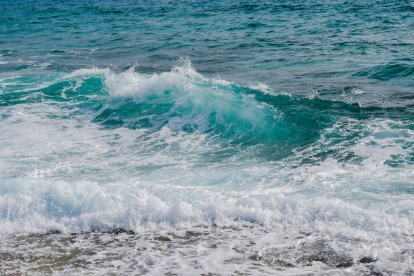 Vibrant ocean waves crashing onto the shore, showcasing the energy and serenity of the sea Nature 4K