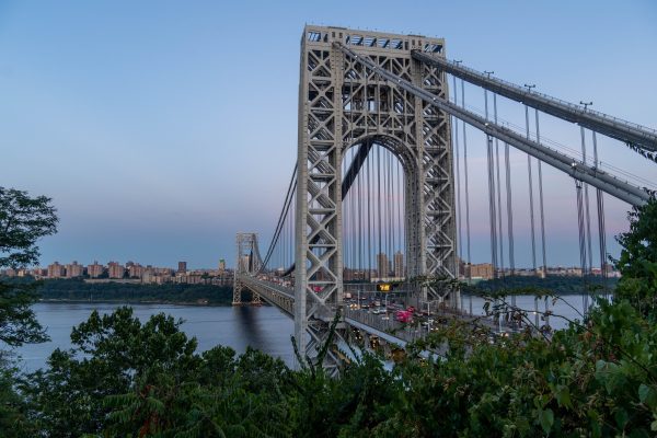 View of George Washington Bridge at twilight over Hudson River, showcasing urban architecture and cityscape. Architecture 4K