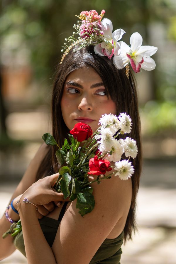 Woman in Ciudad de México with flowers and artistic makeup, showcasing natural beauty. Mobile 4K